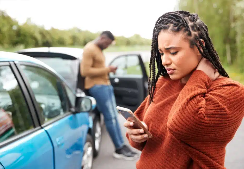 two people in a car accident on their cell phones