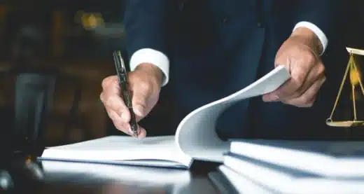 person flipping through law books