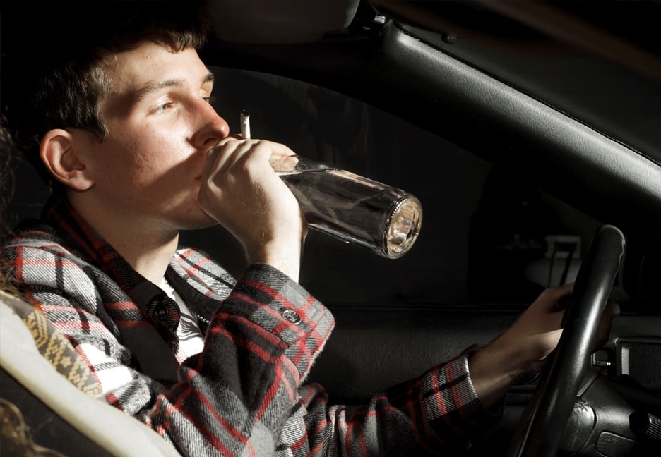 man drinking while driving