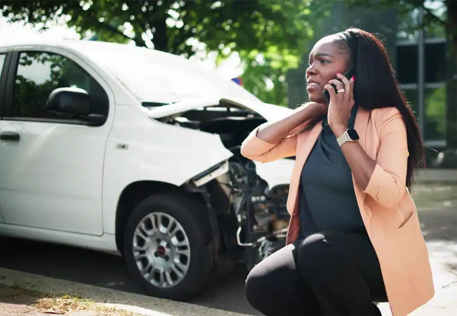 woman on phone after being in a car accident