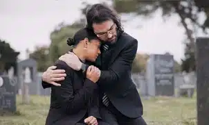 grieving couple at funeral