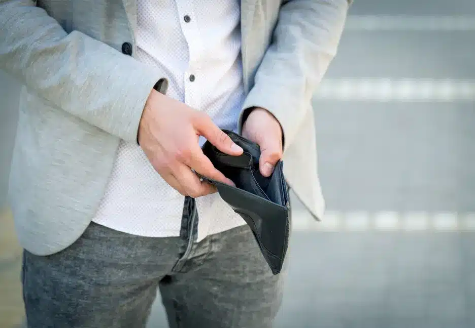man opening empty wallet