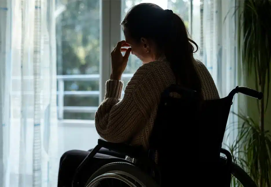 sad woman in a wheelchair