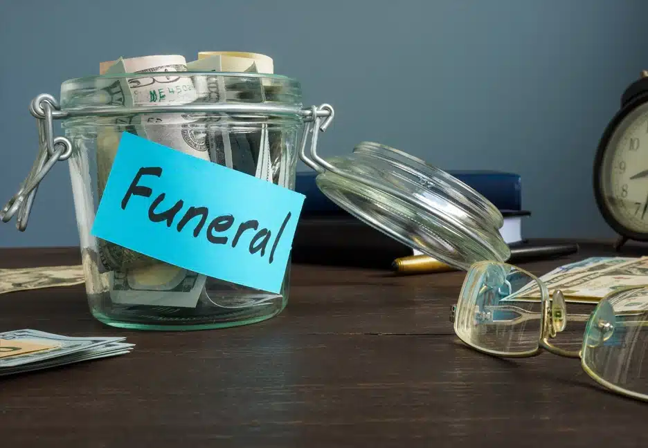 jar filled with money labeld "funeral"